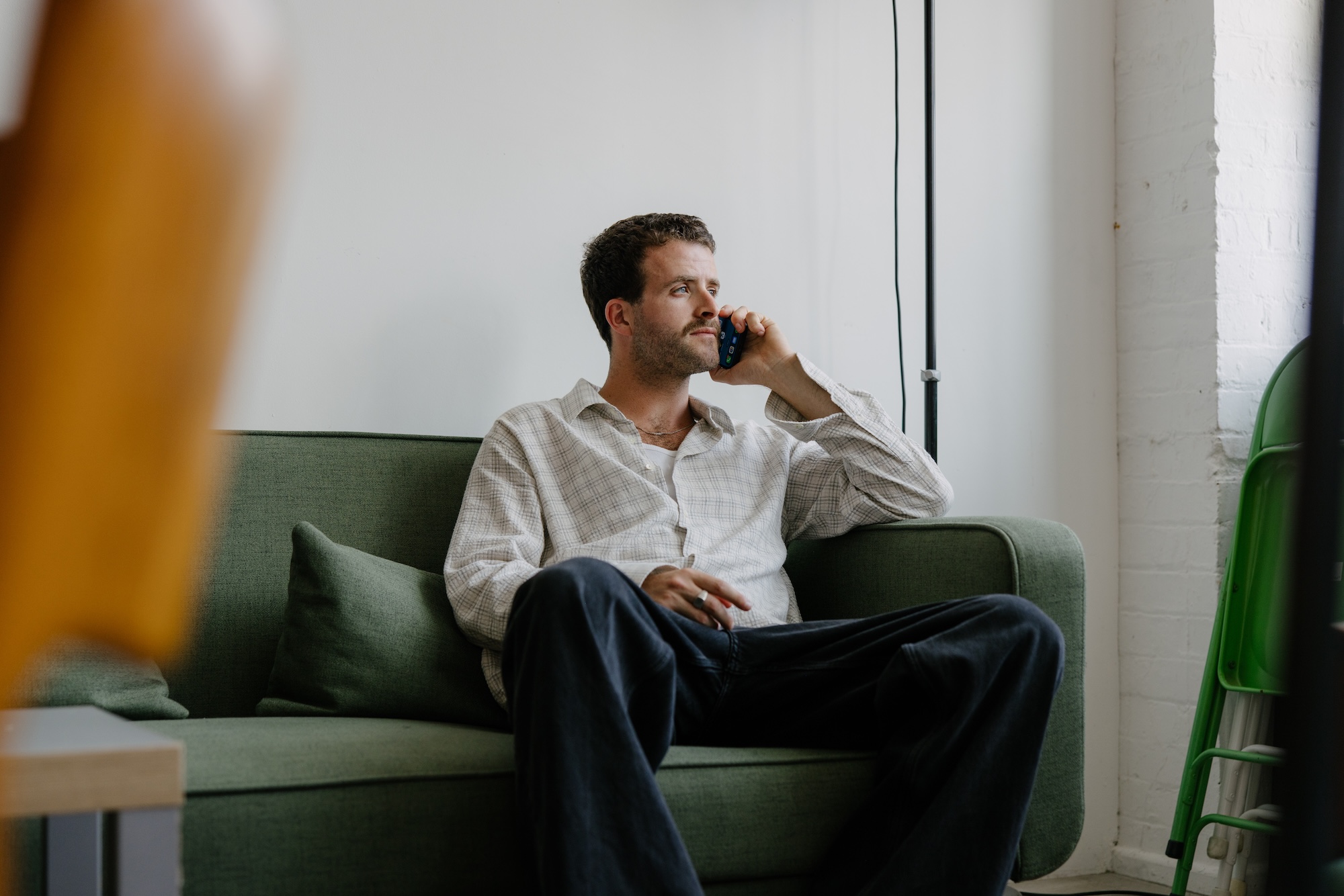 A Blossom customer on a phone call at home