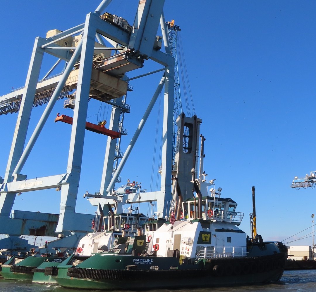 Ship-to-shore cranes and tugboats at the Port of Wilmington, Delaware