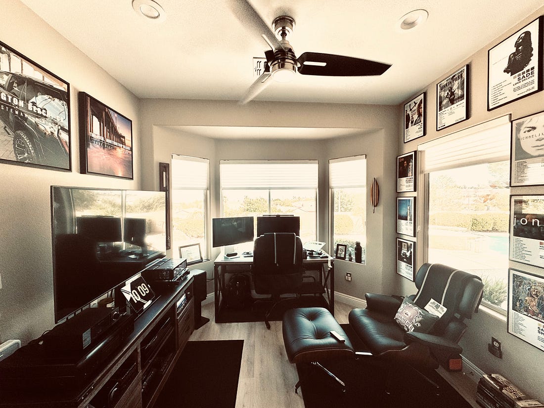 Allen’s music room with framed album art, turntable and listening chair