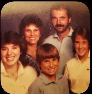 A second vintage family portrait from Angie’s family album, with two adults and three children.