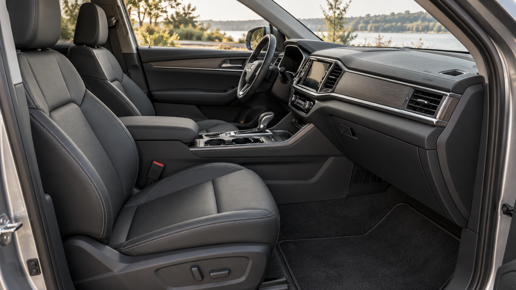 Clean charcoal SUV seats, console, door trim, and floor mats