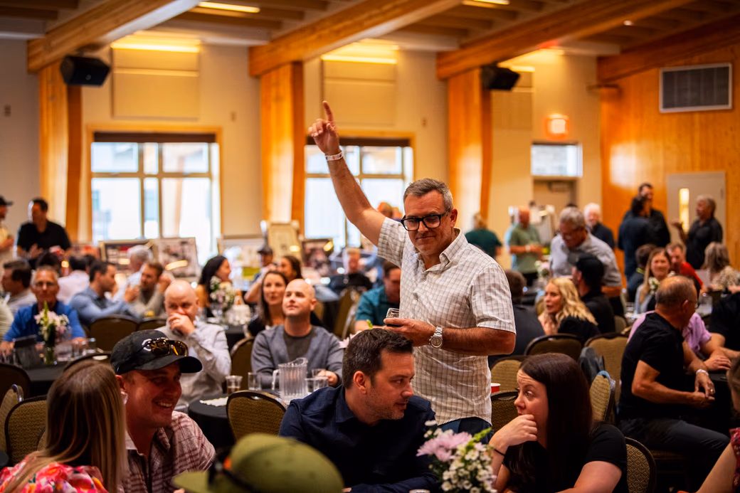 Guests bidding at a Community First Society fundraising auction