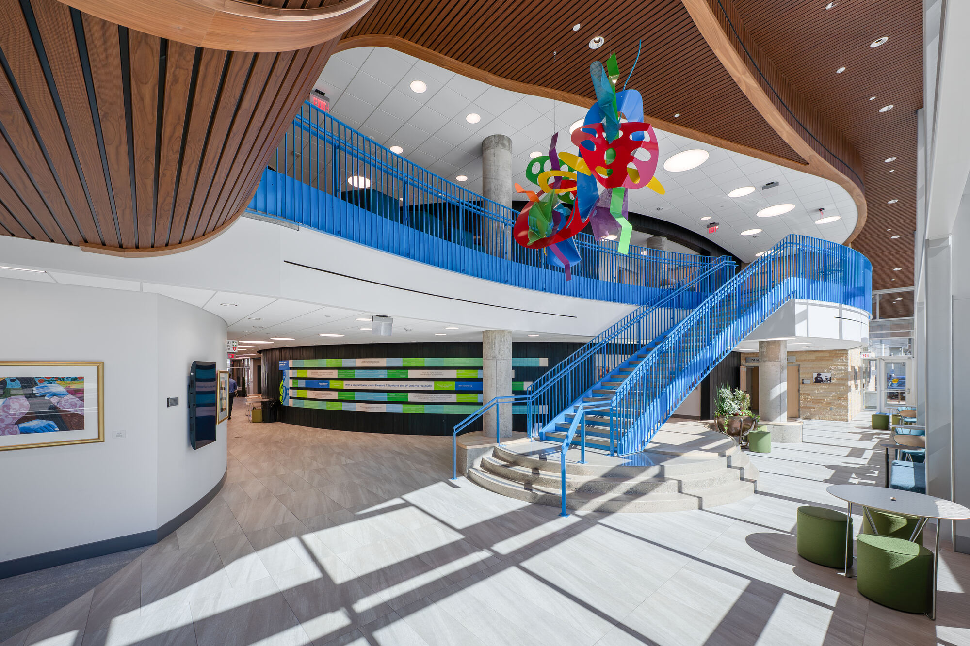 The WYSO Center lobby with its blue staircase and colorful hanging sculpture