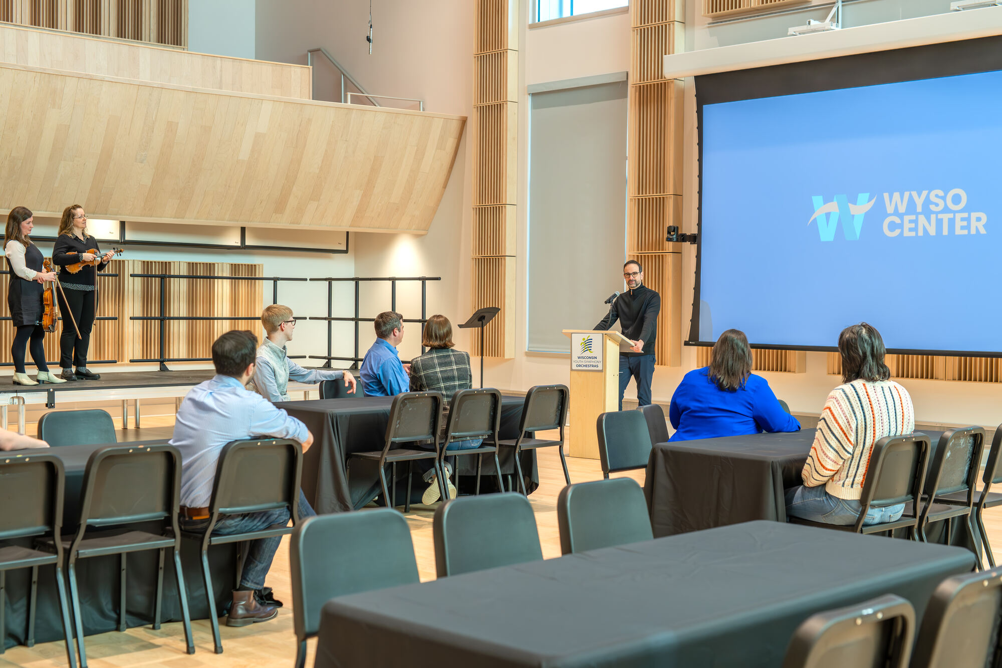 A presenter at a podium in Marvin Rabin Hall