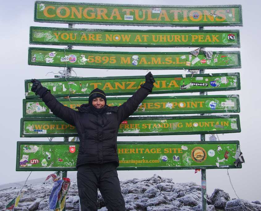 Emma Harrison on the summit of Mt Kilimanjaro.