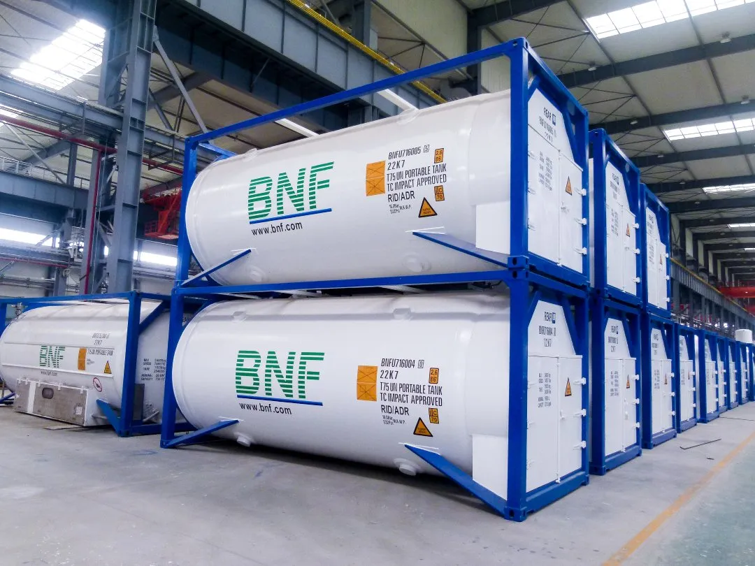 BNF T75 ISO tanks stacked in their blue frames in a workshop