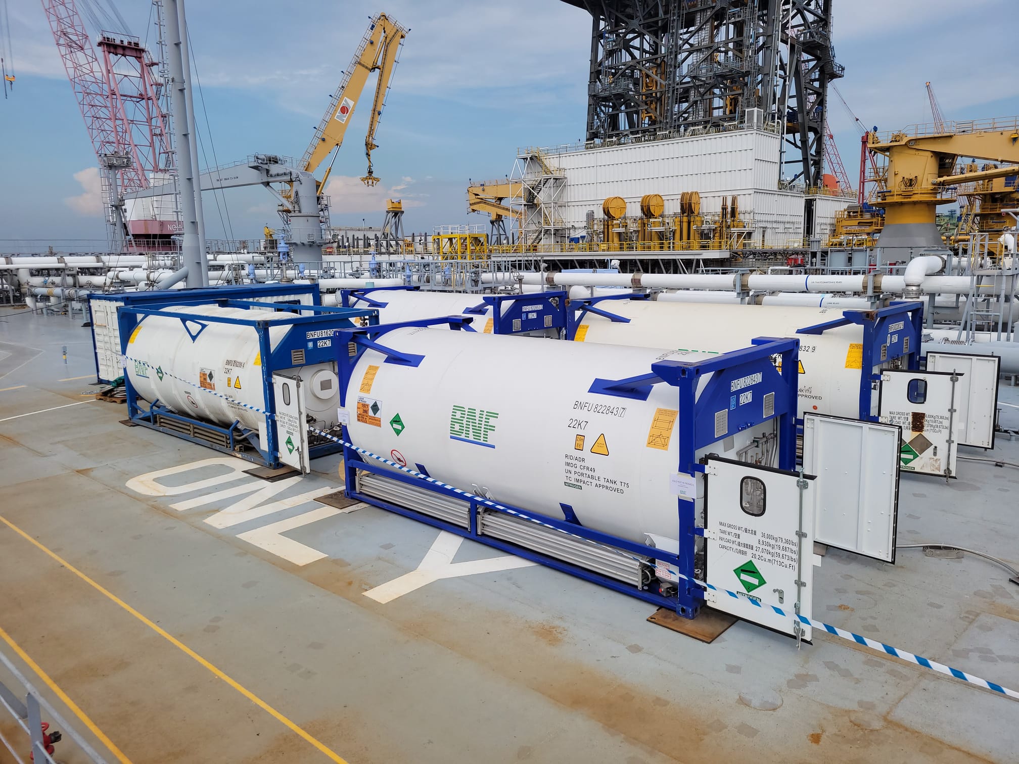 BNF T75 ISO tanks lashed on deck at a shipyard