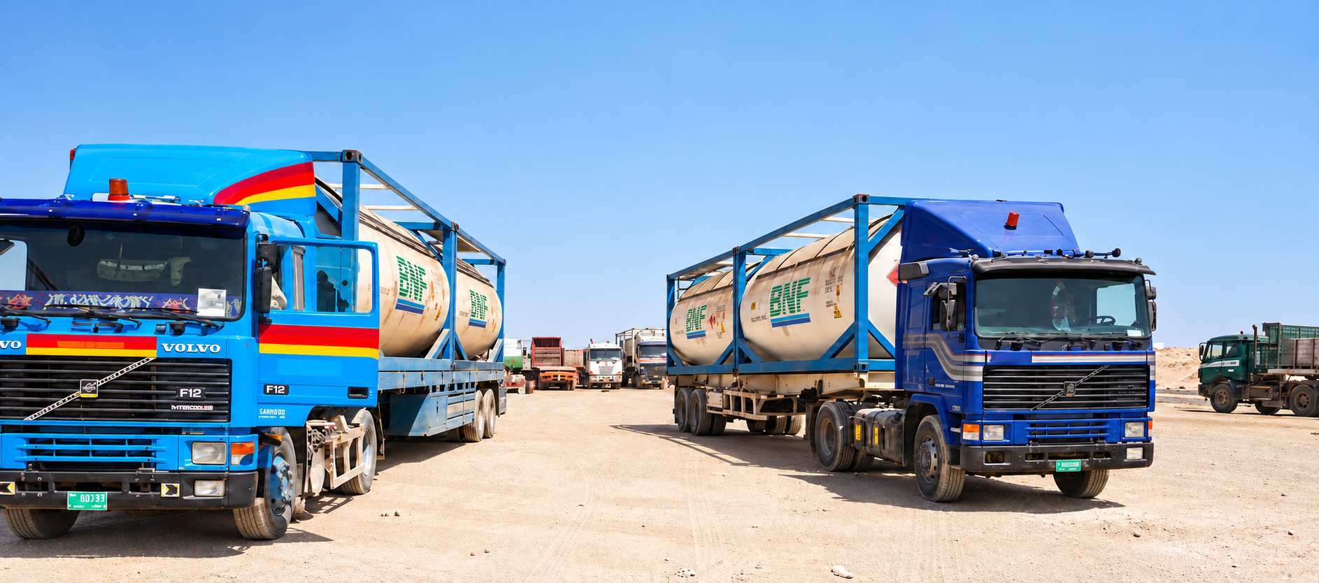 BNF ISO tanks on trailers at the quayside beside a vessel