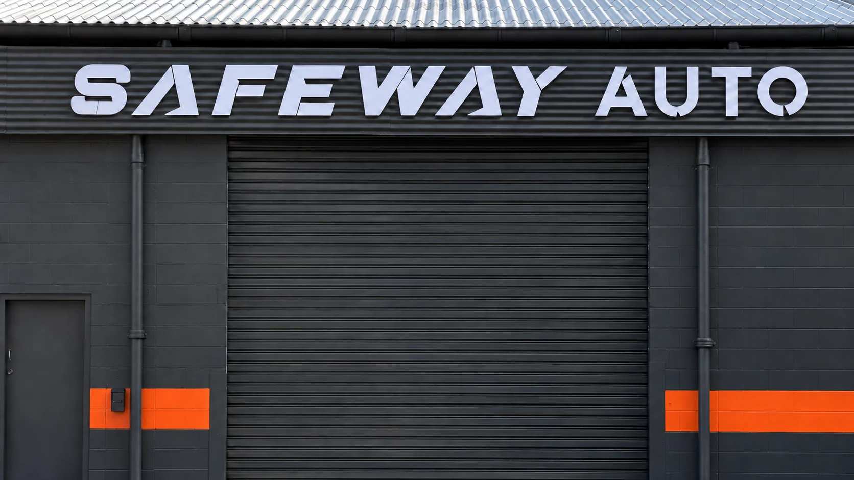 Safeway Auto signage above the showroom roller door in West End, Brisbane