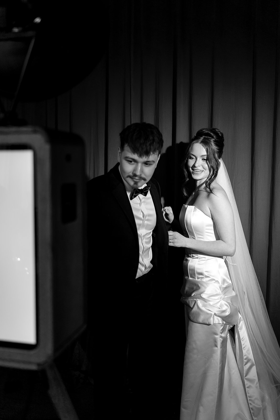 Black and white photo of a bride and groom at the ICON photo booth