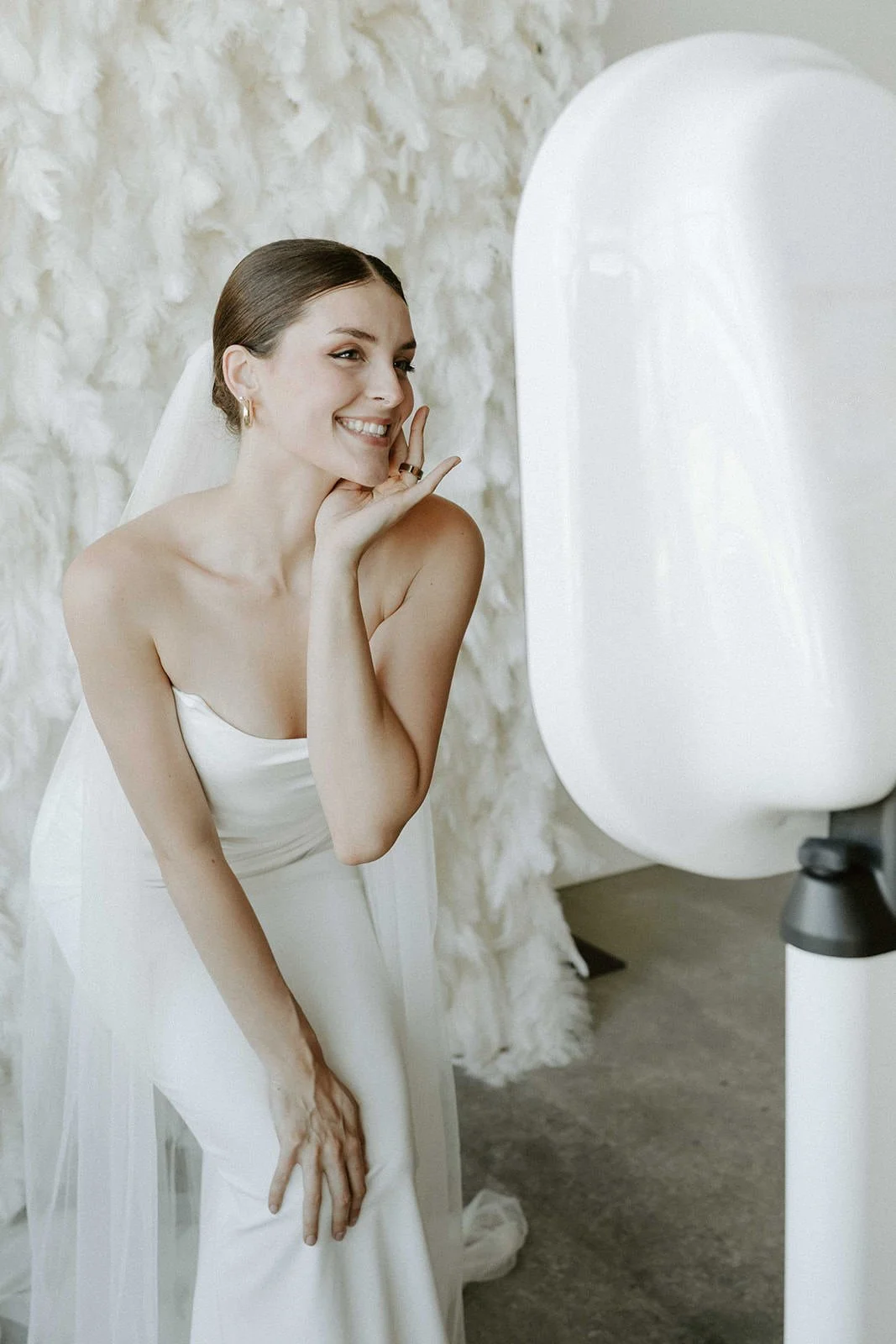 Bride smiling at the Halo booth