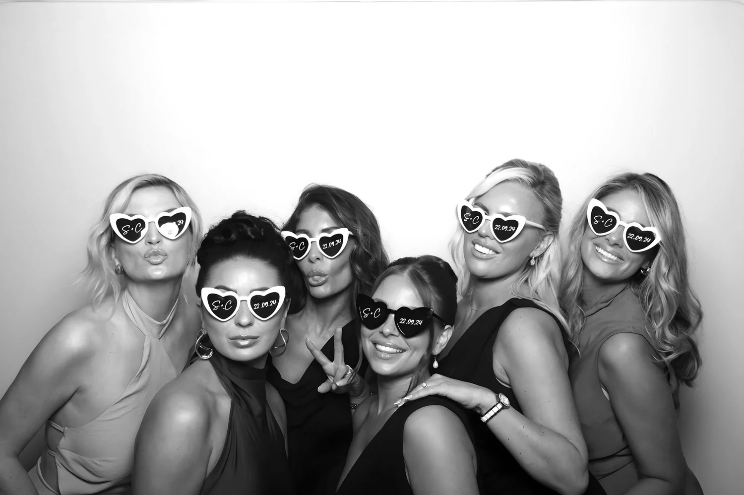 Guests in heart sunglasses in a glam portrait
