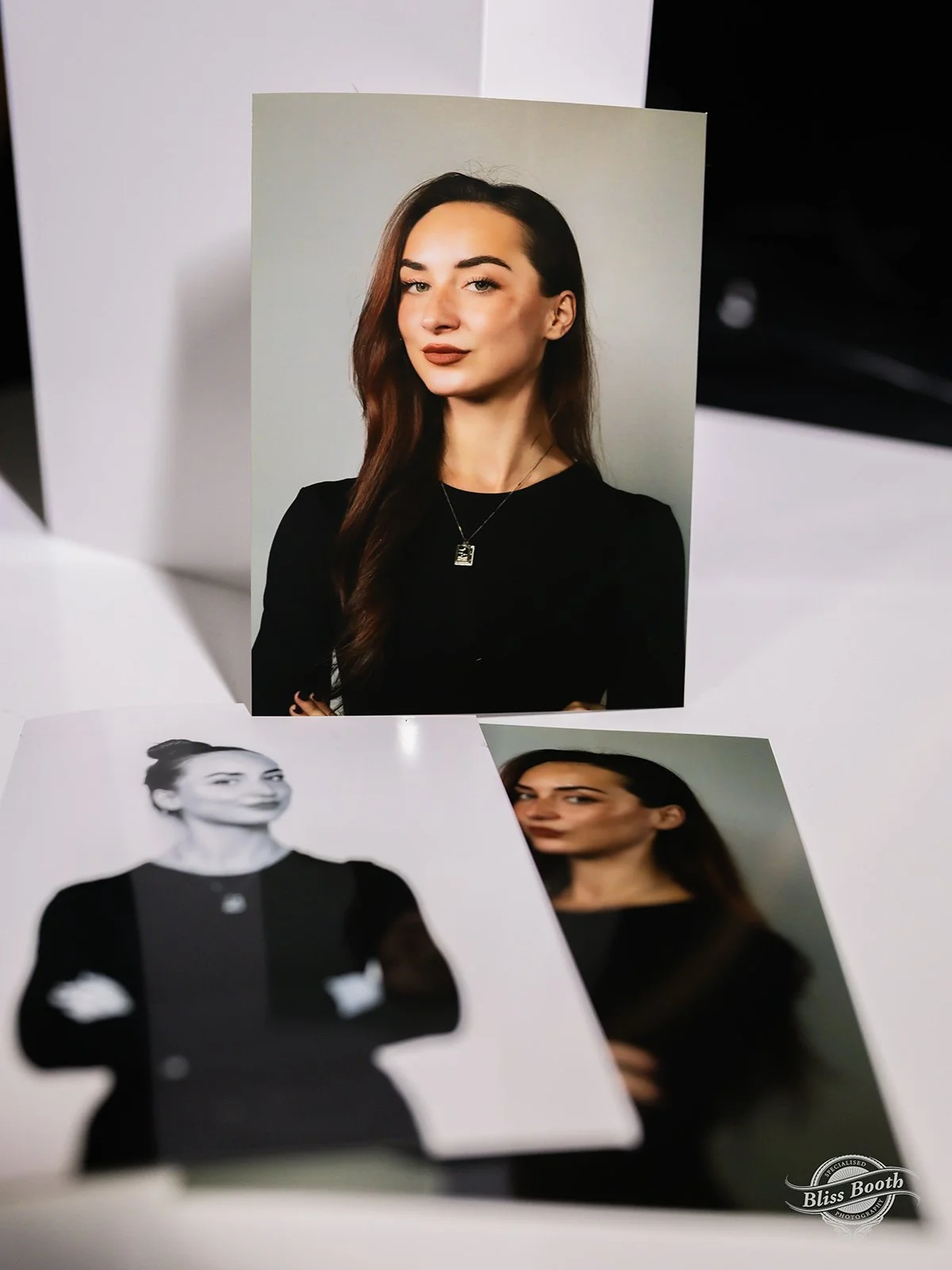 Printed headshots of a guest in black