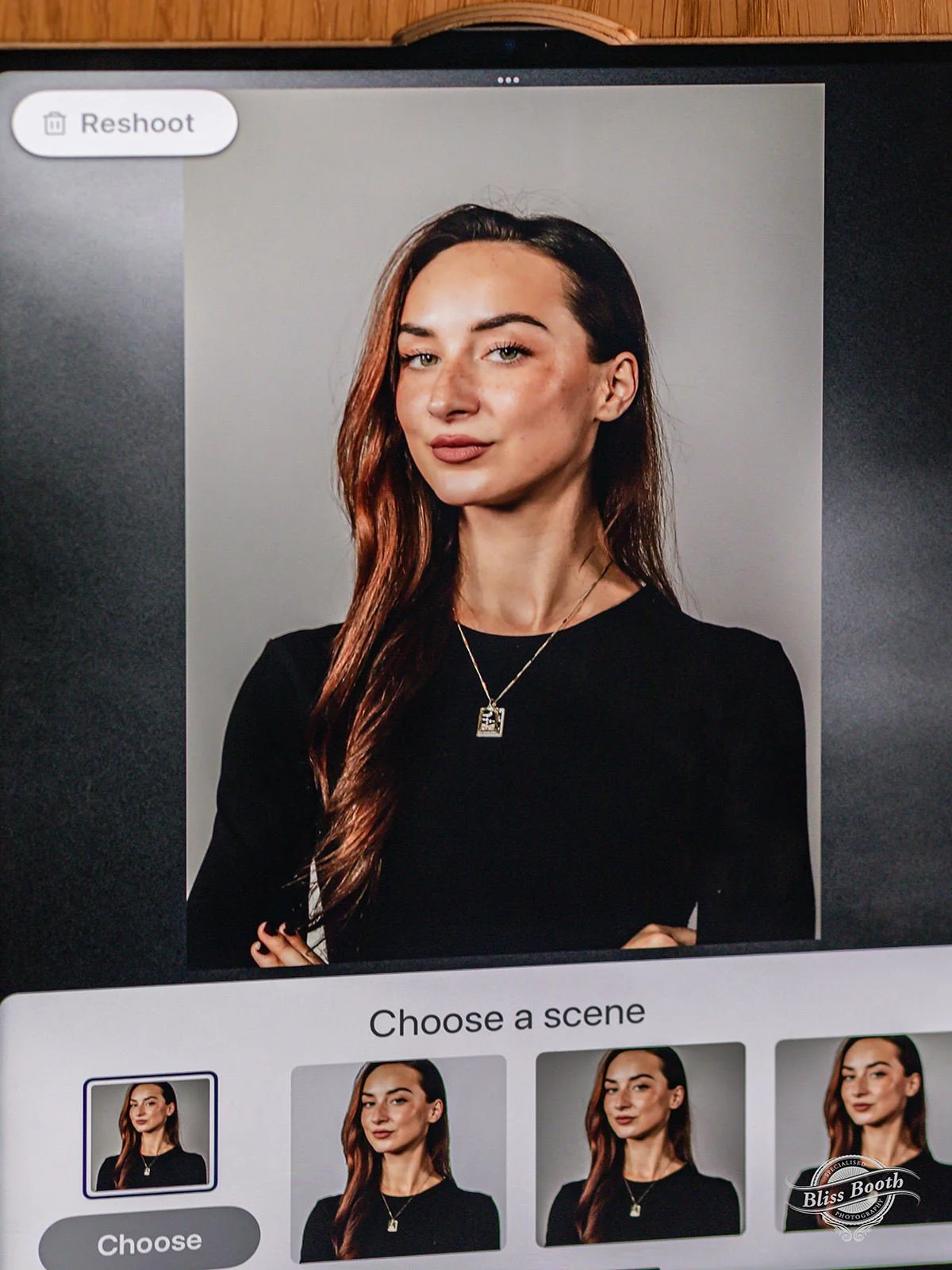 Professional headshot displayed on the booth screen with print options