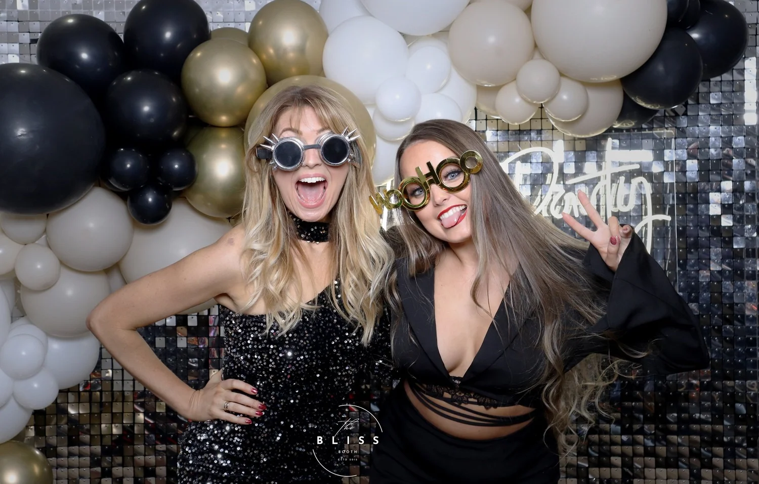 Guests enjoying the Bliss Booth photo booth experience at a Christmas party at Tankersley Manor. Instant prints, festive props and unforgettable moments helping colleagues celebrate the festive season