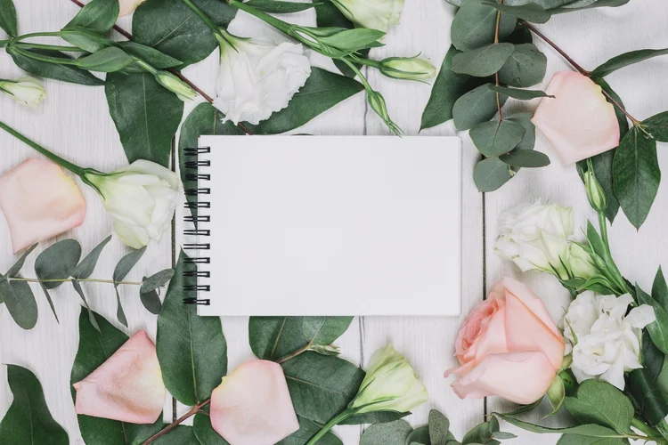 Open photo booth guest book with white roses