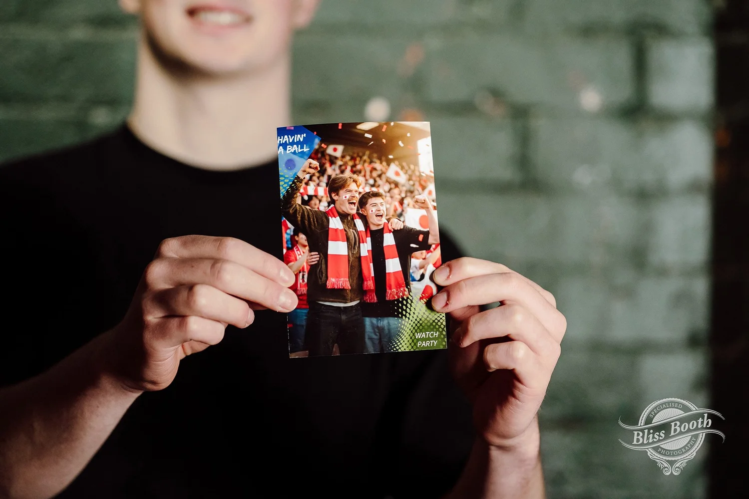 Guest holding a printed magazine-style portrait