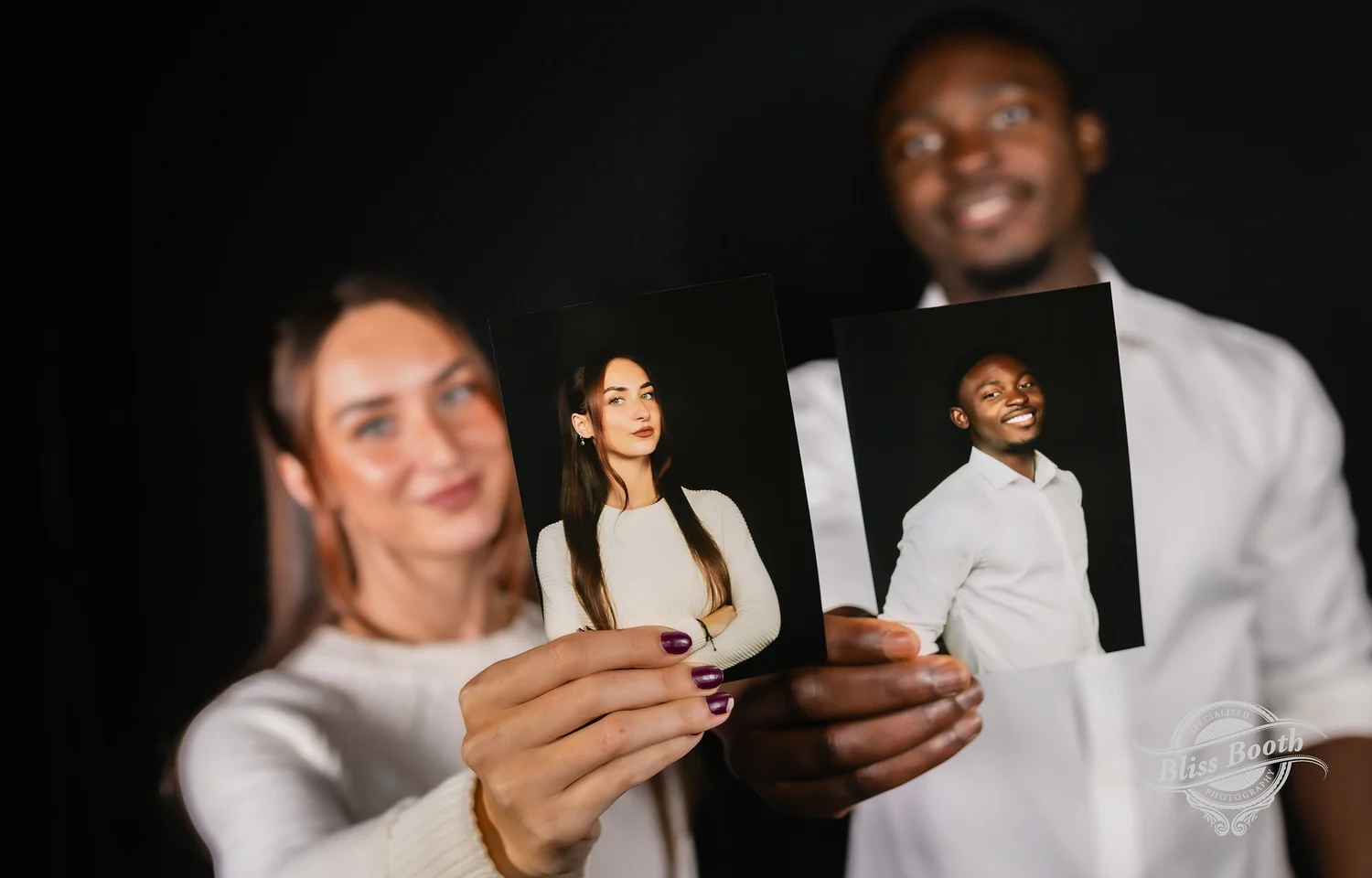 Guests holding their printed professional headshots