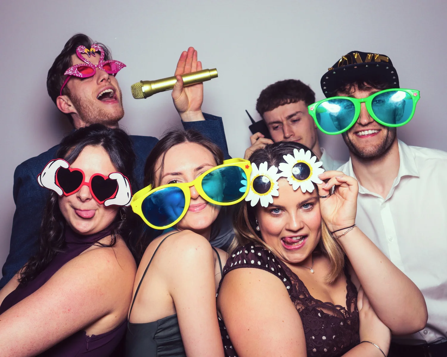 Wedding guests enjoying the Bliss Booth photo booth experience at Hazel Gap Barn. Instant prints, fun props and unforgettable wedding memories at one of Nottinghamshire's most popular wedding venues.