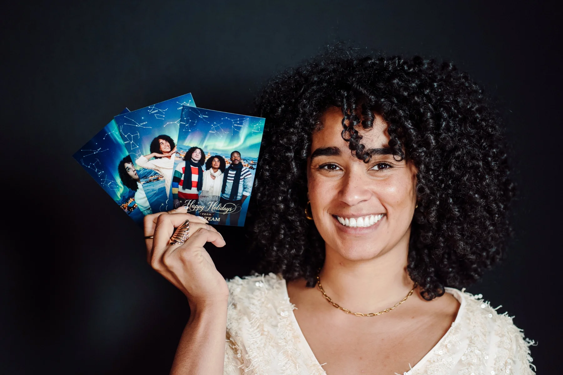 Guest smiling with her personalised festive photo cards