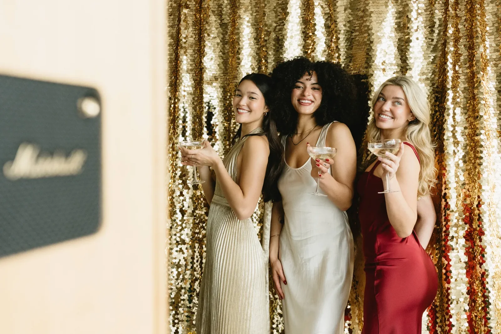 Sequin backdrop photo booth set up for a Christmas party