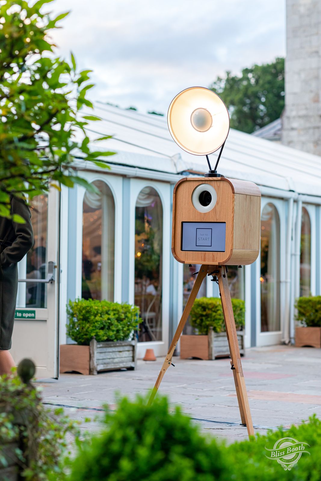 Retro photo booth with beauty dish light outside a glass orangery wedding venue