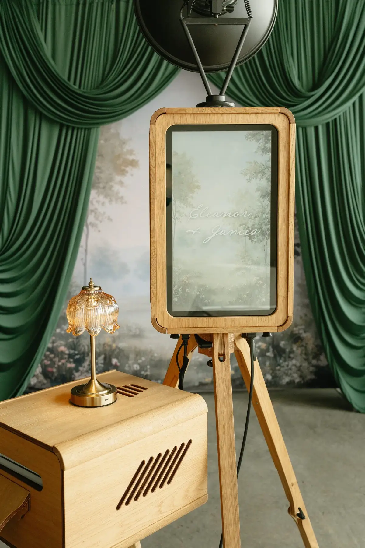 Solid oak ICON photo booth with print station at a wedding