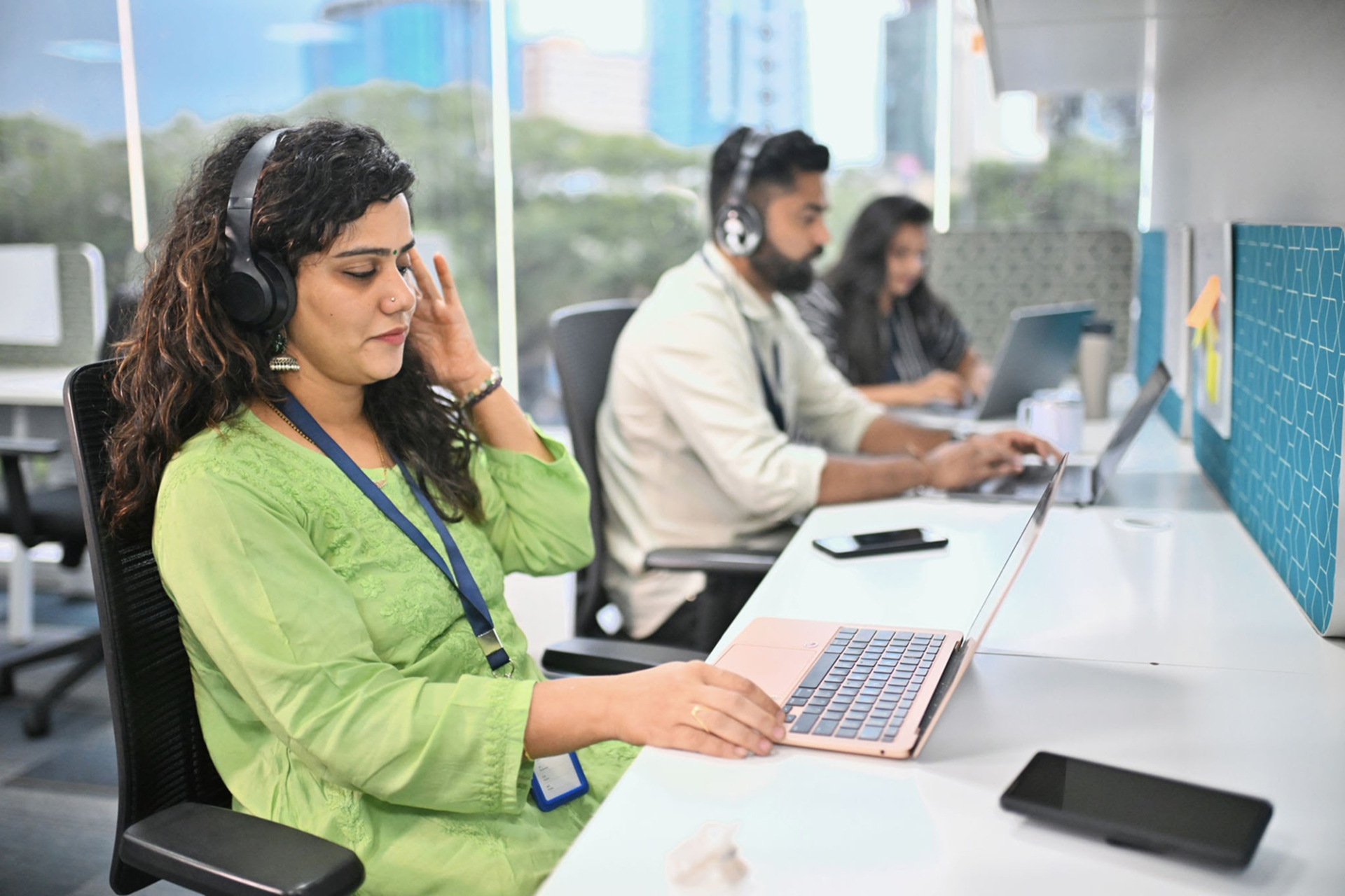 Professionals reviewing offer letter variables and talent sourcing data