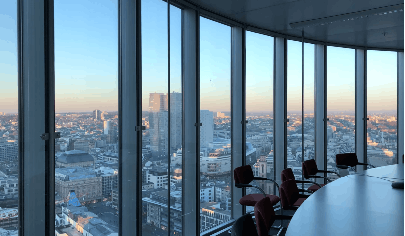 Team in a boardroom reviewing enterprise-scale talent sourcing and hiring strategy