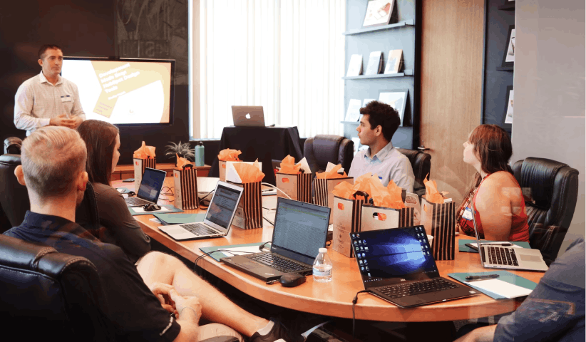 Leadership presenting compensation benchmarking data for mission-critical engineering roles