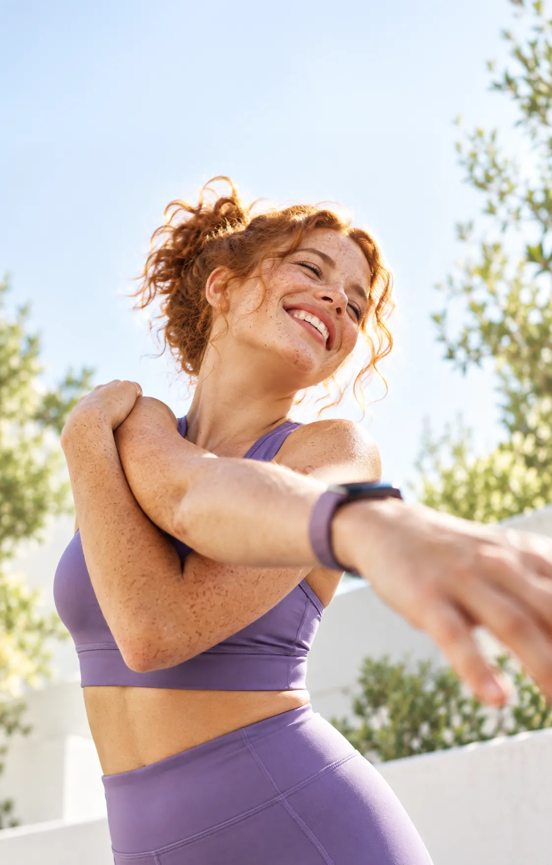 Woman smiling during an outdoor workout