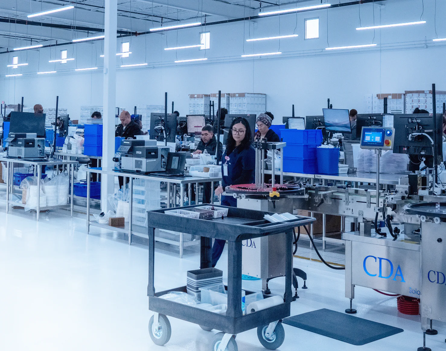 Technicians working in the Evoluciona Pharma compounding facility in Stafford, Texas