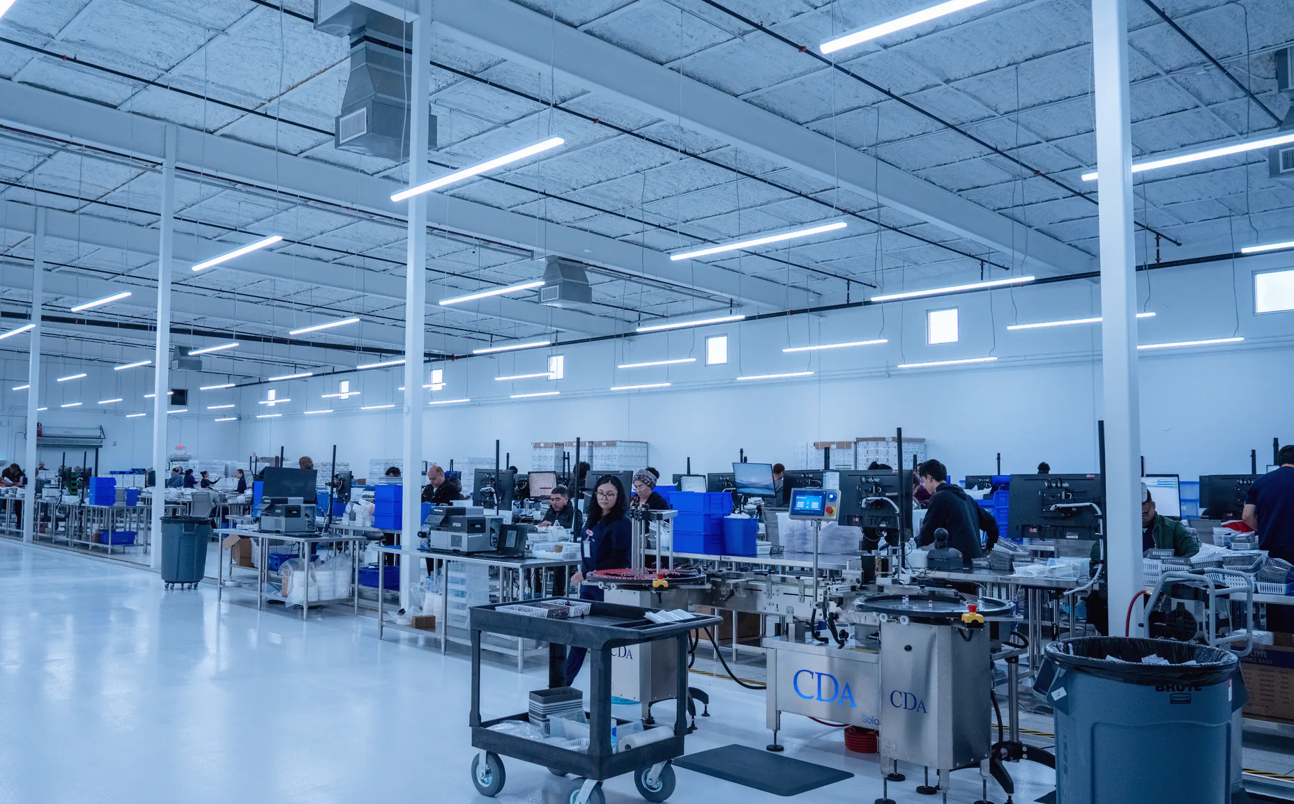 Technicians working in the Evoluciona Pharma compounding facility in Stafford, Texas