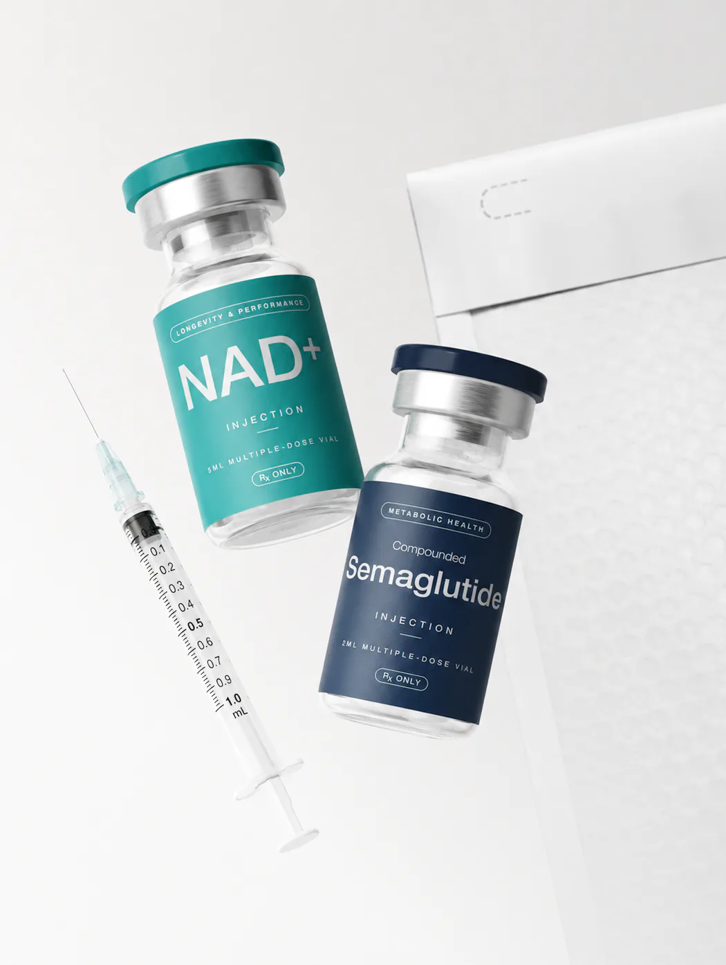 NAD+ and semaglutide vials with a syringe and shipping box