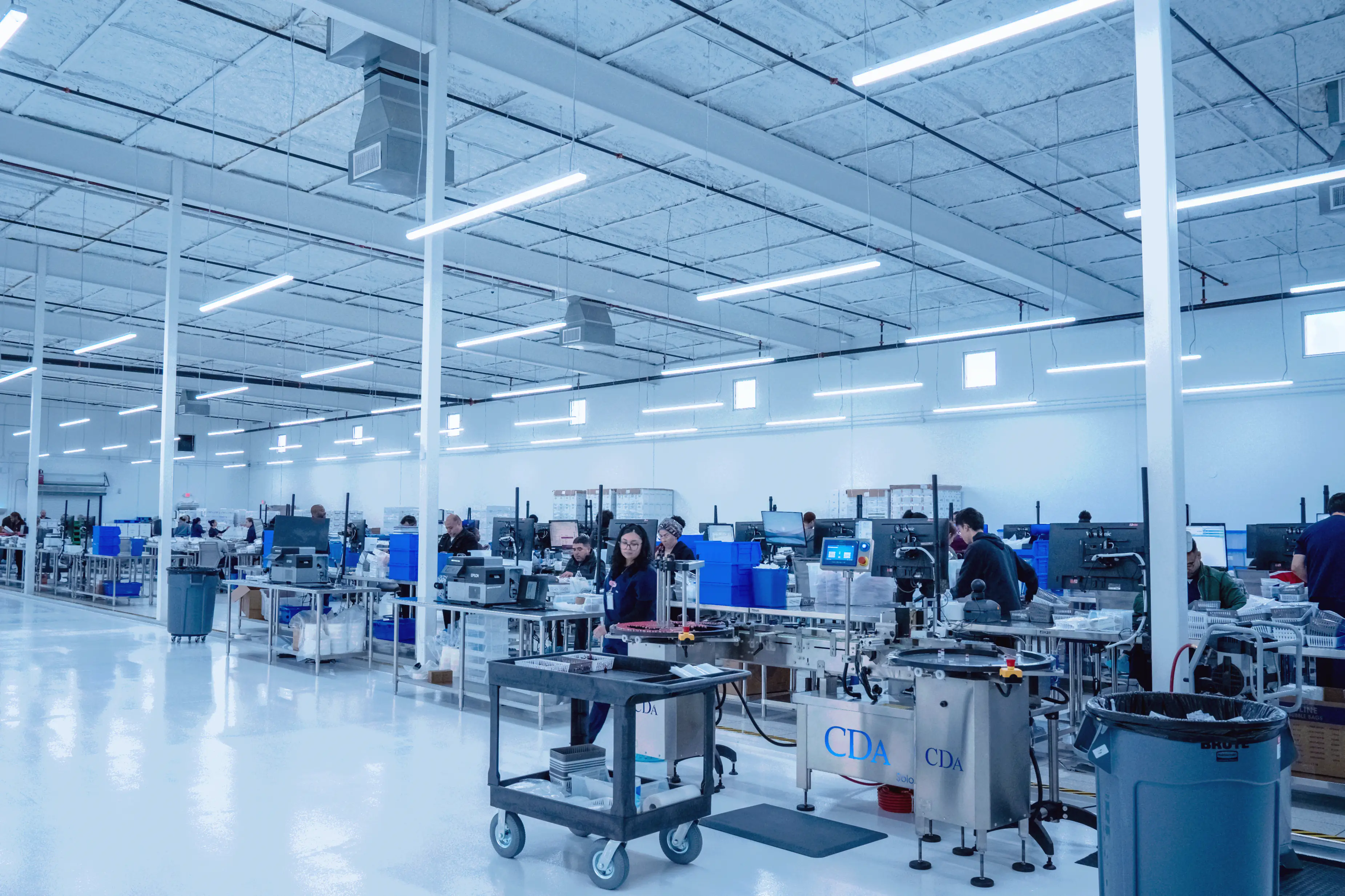 Technicians working in the Evoluciona Pharma compounding facility in Stafford, Texas