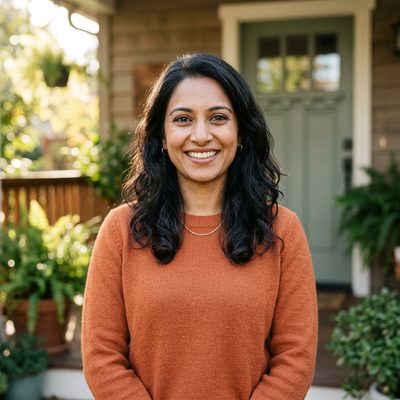 Smiling homeowner on her front porch