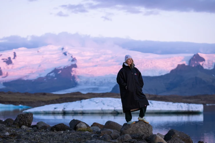 dryrobe wearer at a glacial lagoon