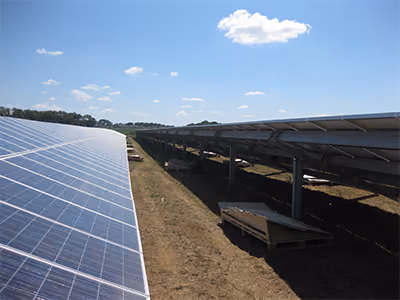 Rows of solar panels across a large field