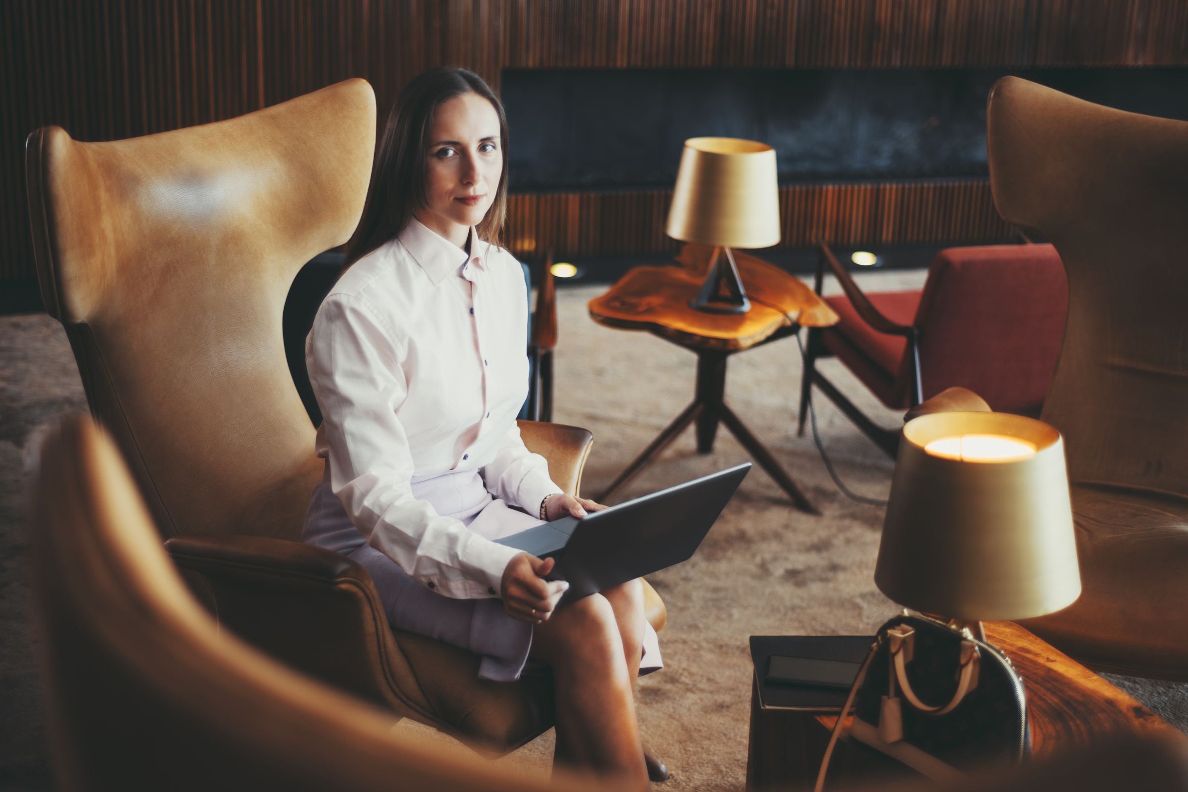 Guest relaxing in a luxury hotel lounge