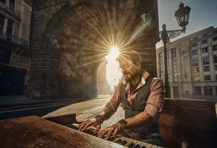 Musician performing in a Prague bridge tower