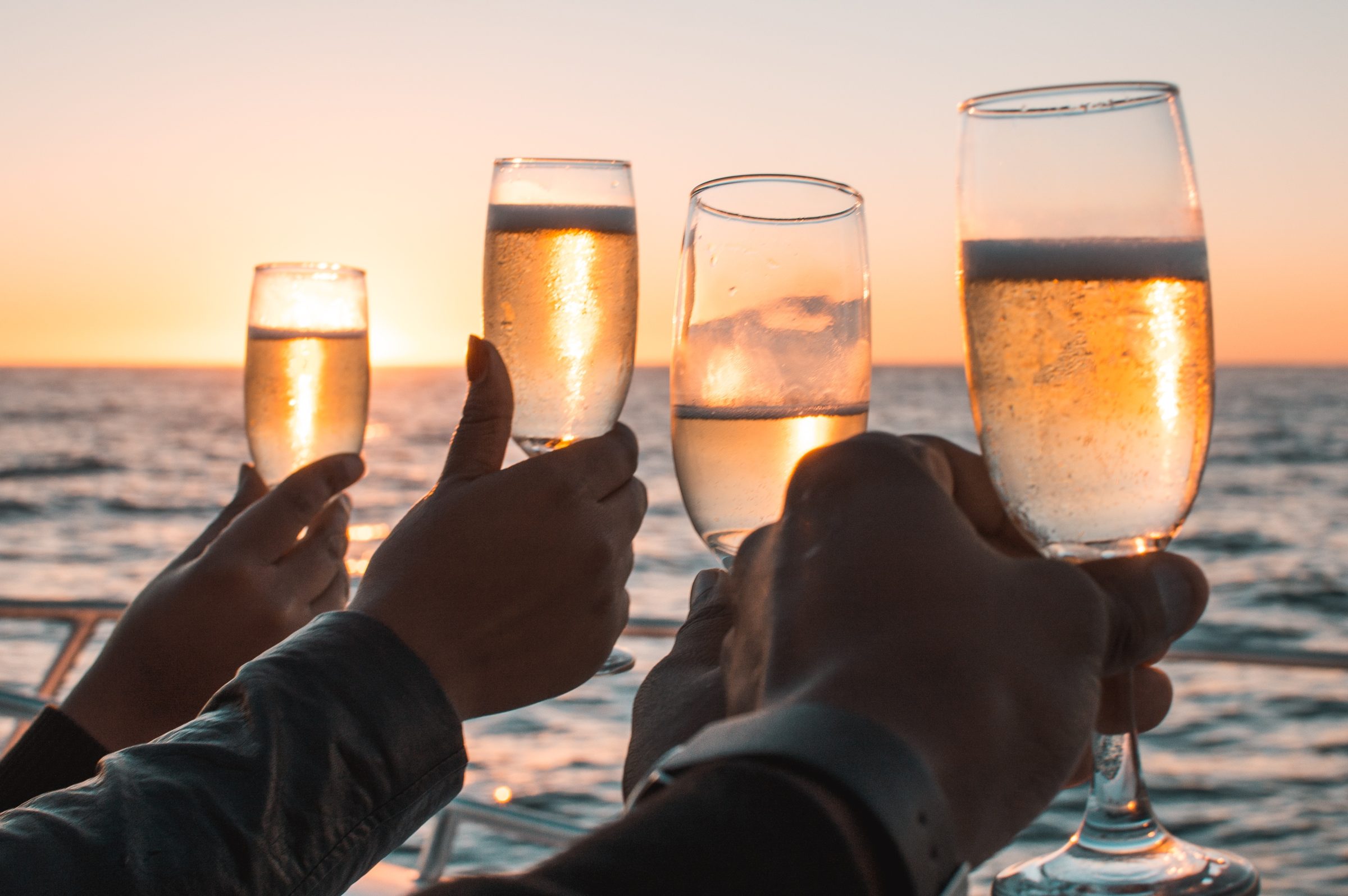 Champagne toast at sunset on a yacht