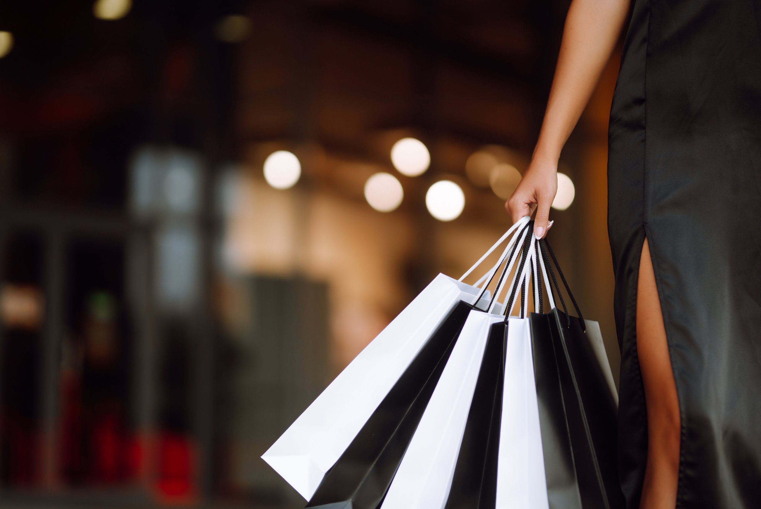 Two women with shopping bags on a city street