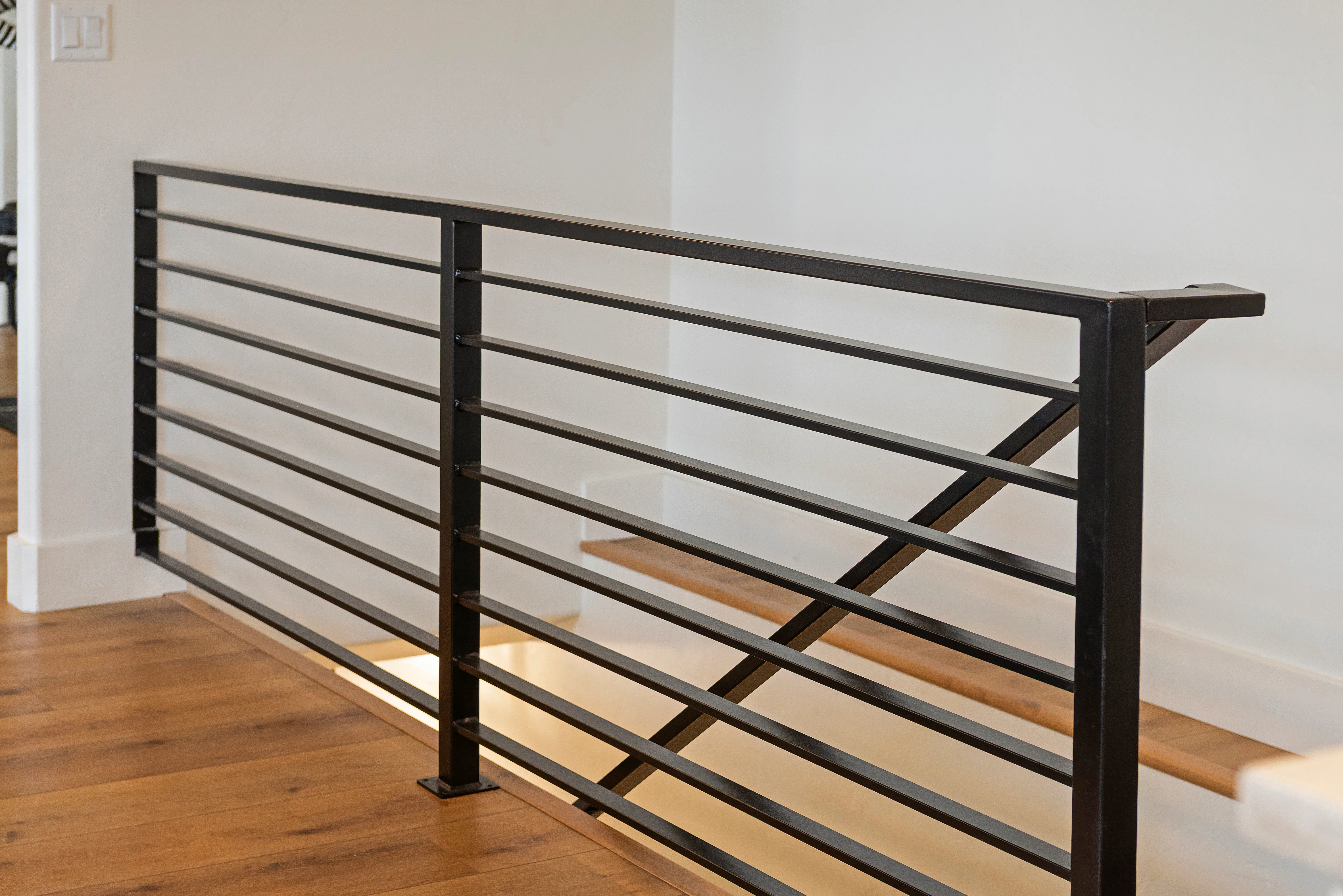 Finished black steel stair railing