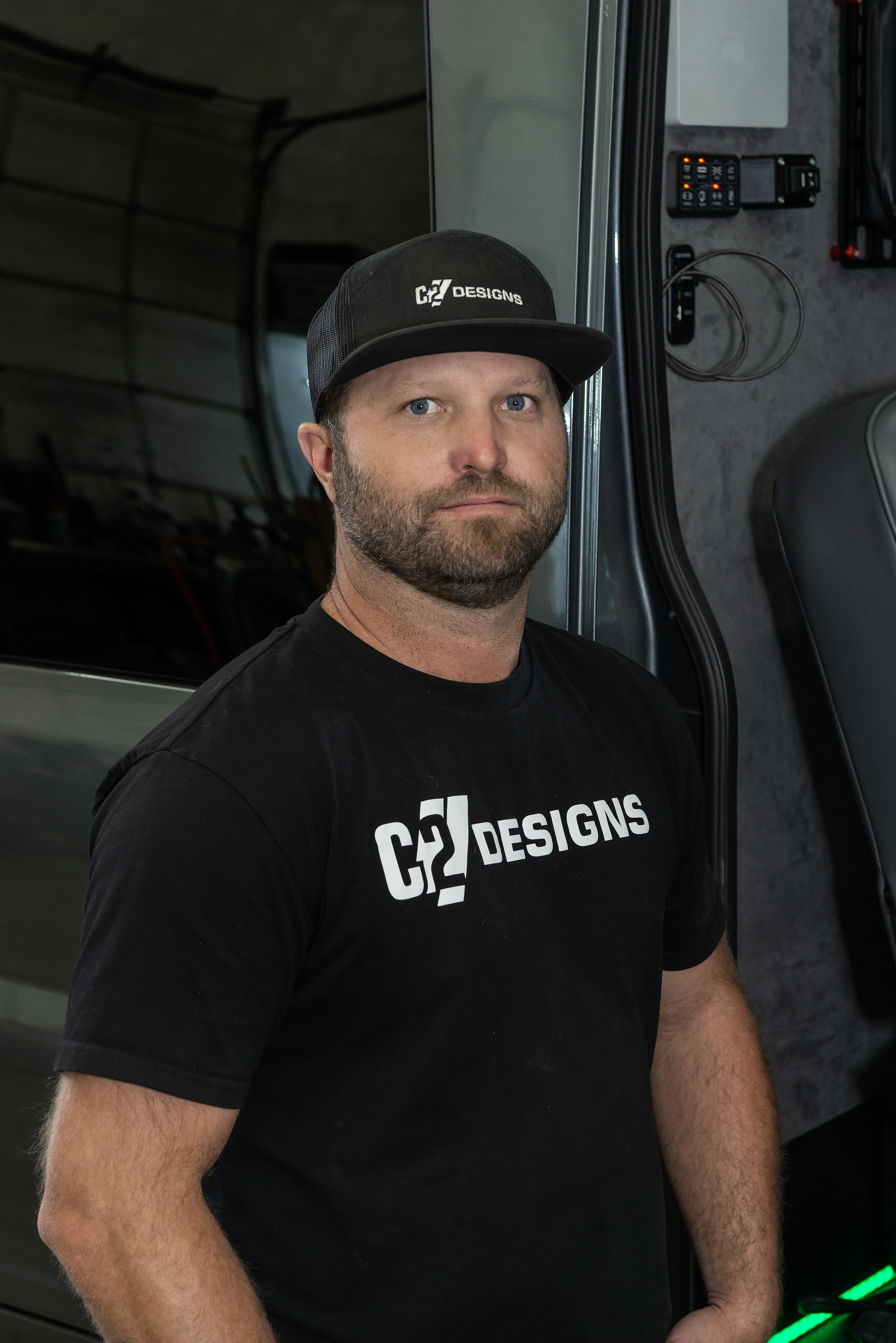 C2 Designs team member beside a custom van