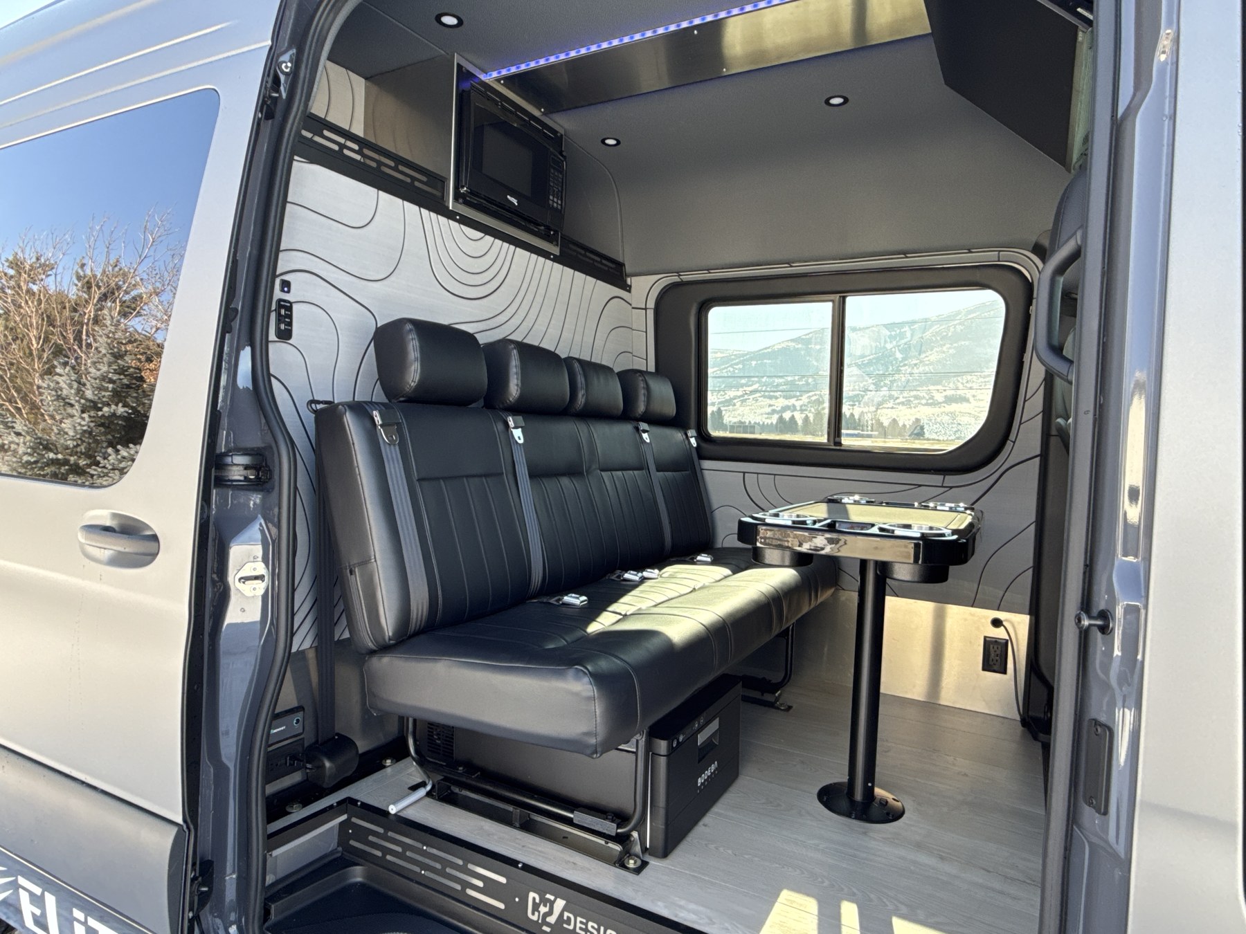 Van lounge with leather bench seating and table