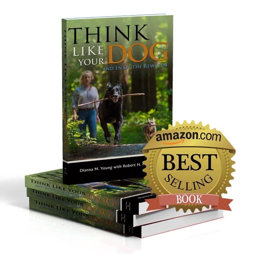 Stack of books titled 'Think Like Your Dog and Enjoy the Rewards' by Dianna M. Young with Robert H., featuring a cover image of a woman walking dogs in a forest, with one dog prominently carrying a stick, alongside an Amazon.com Best Selling Book badge.