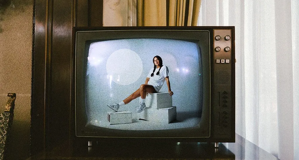 On-model photography from POLA Studio displayed on a vintage television.