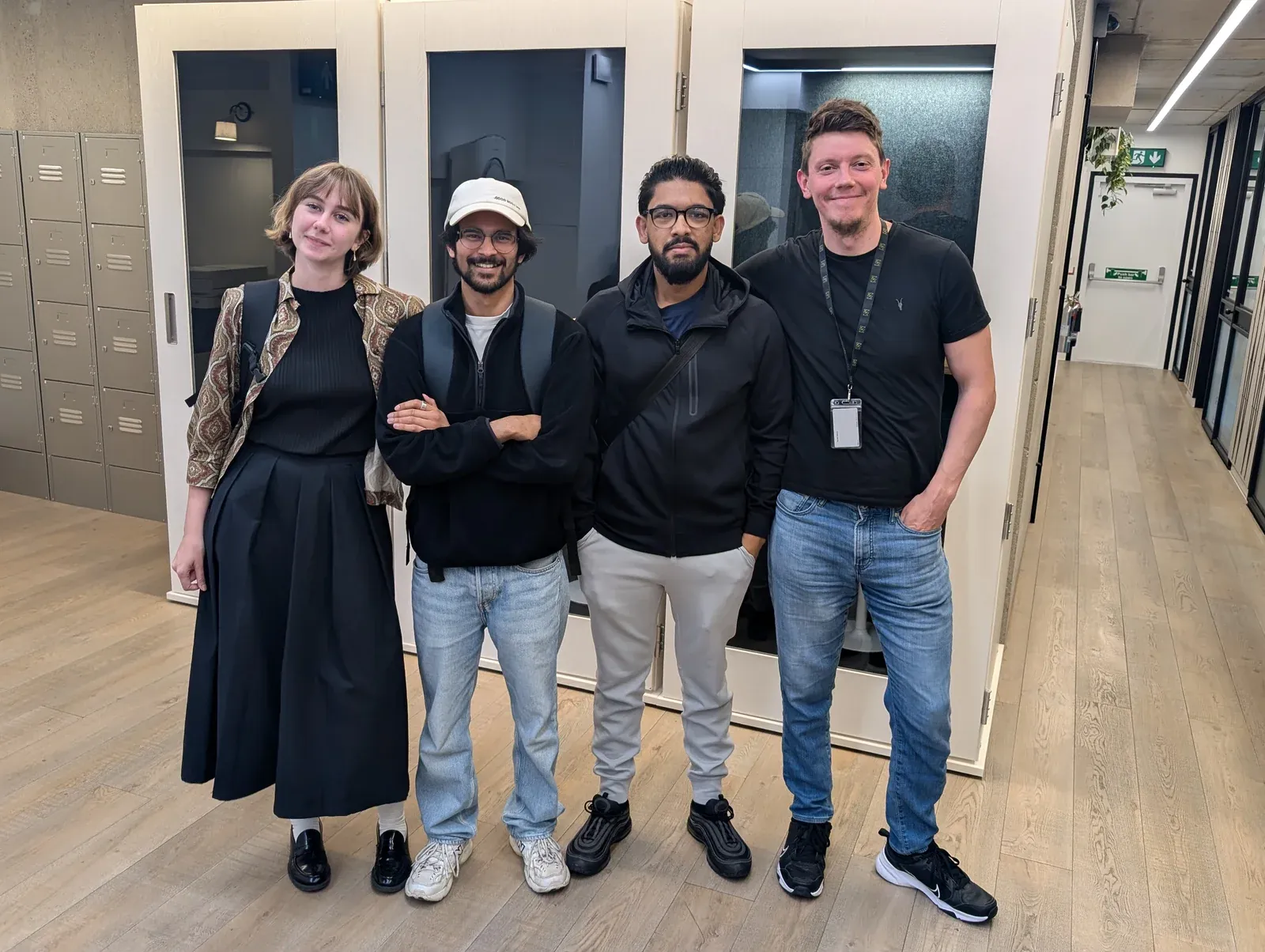 Members of the Voxly Digital team standing together in the Paddington office