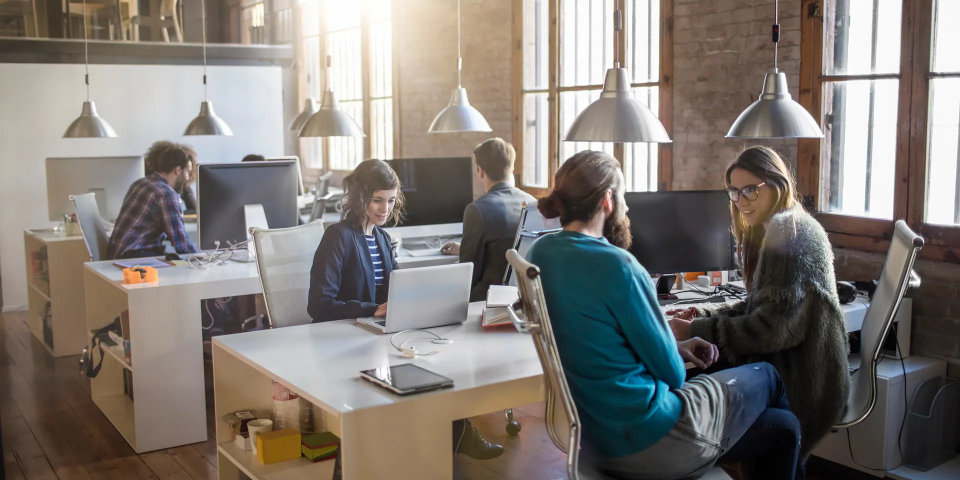 The Voxly Vision team working together in a bright open-plan office