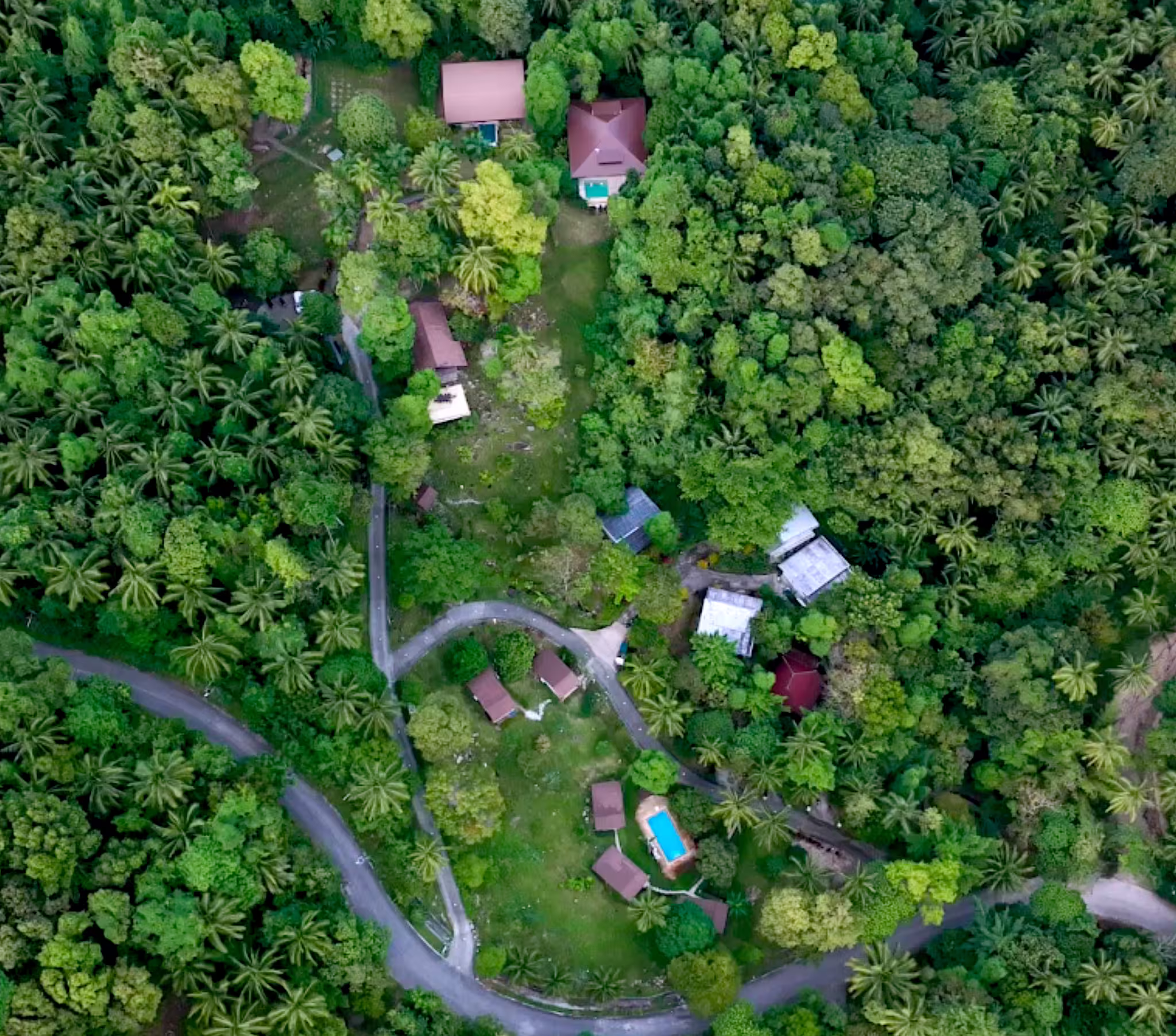 An aerial view of Hidden Valley nestled among tropical trees